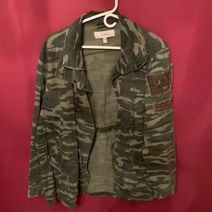 Camouflage jacket with embellishment on arm